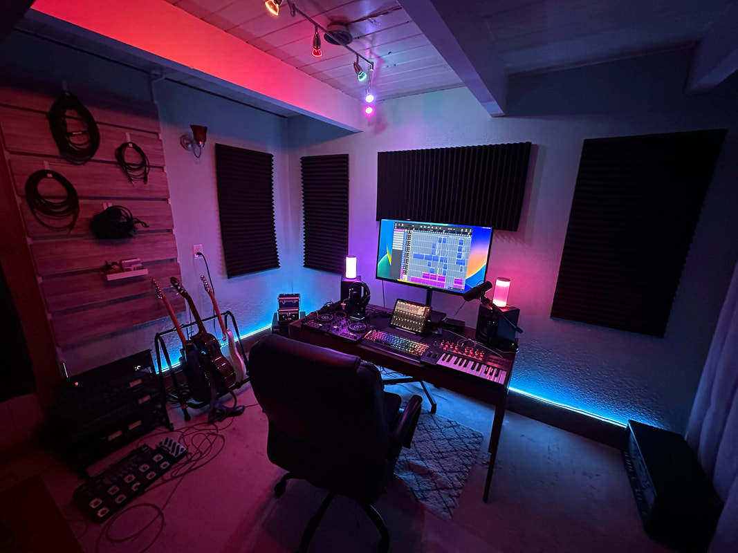 Production desk, instruments, and acoustic treatment inside Fairweather Cottage Studios